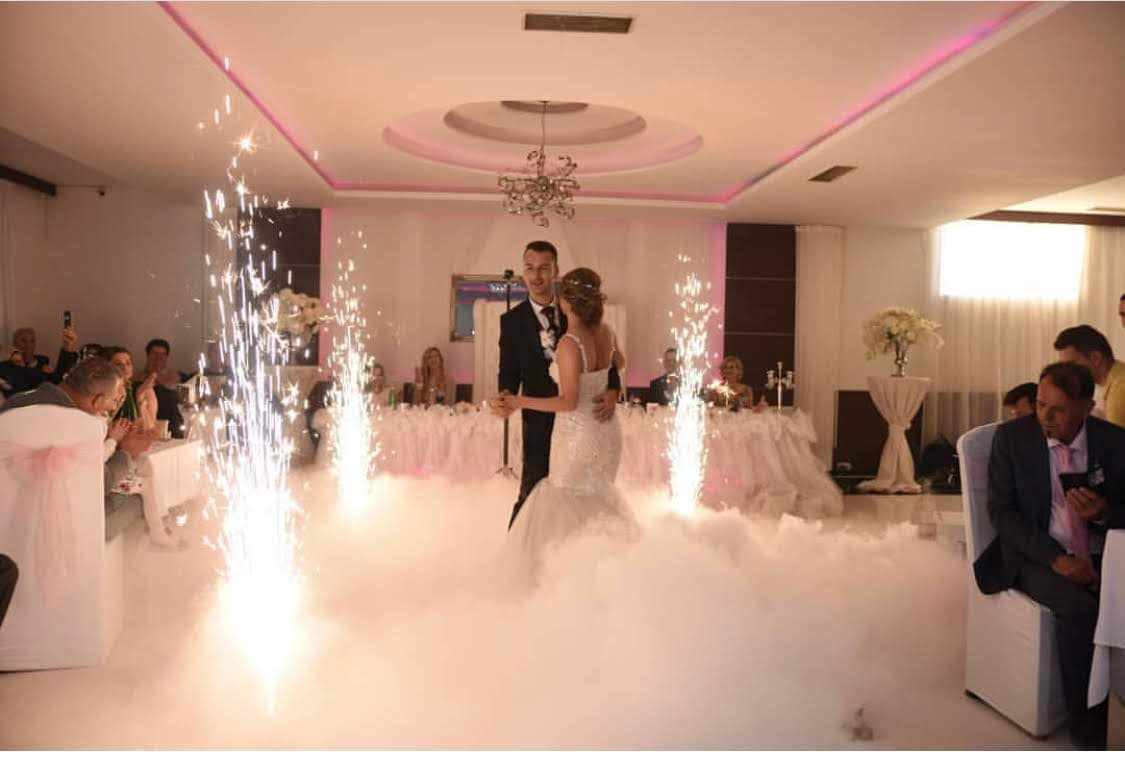 Wedding couple celebrating with professional DJ lighting