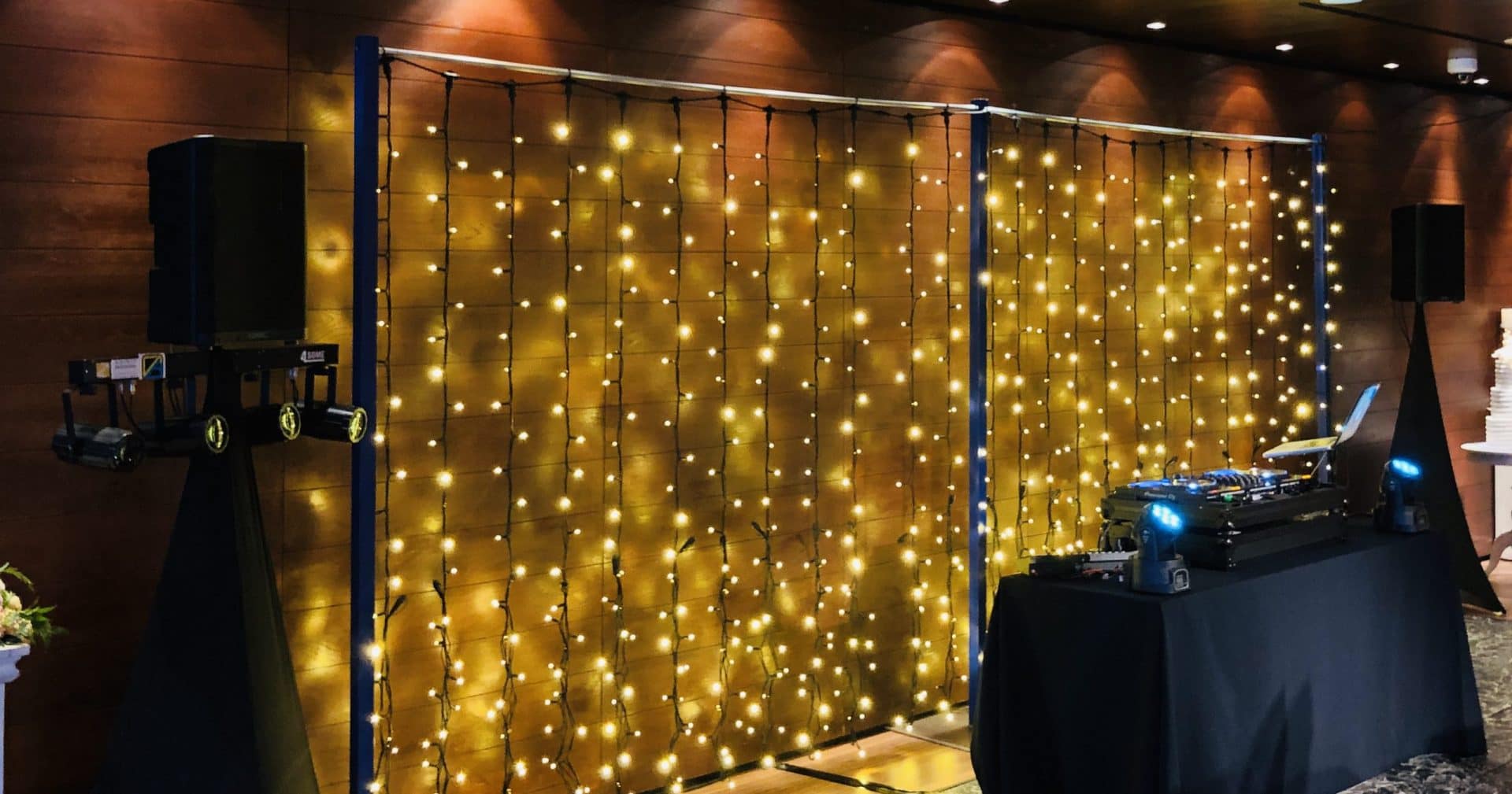 Professional DJ equipment and lighting prepared for a venue event